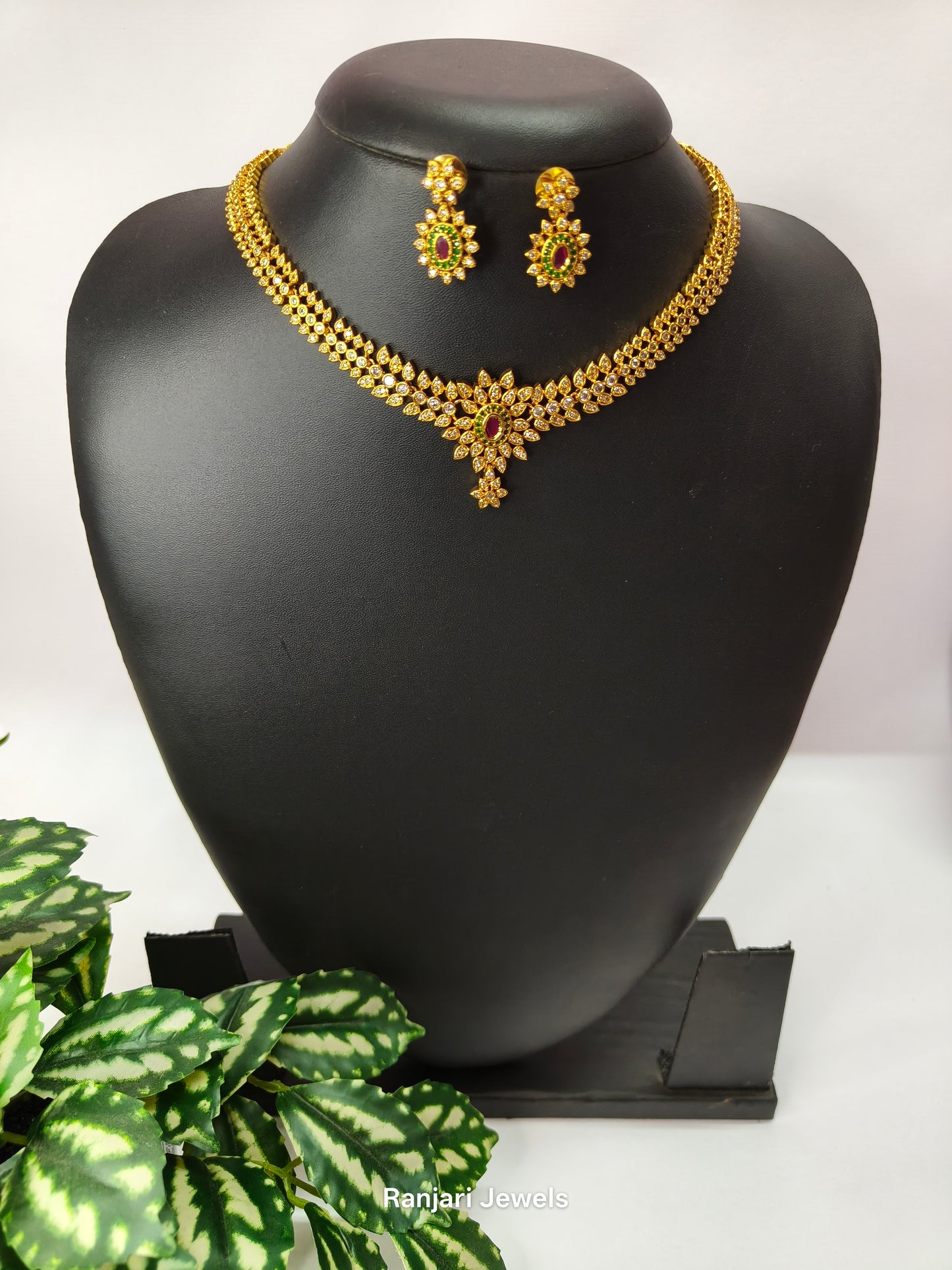 Vidhira – Gold-Plated AD Stone Necklace Set with Ruby & Emerald Accents
