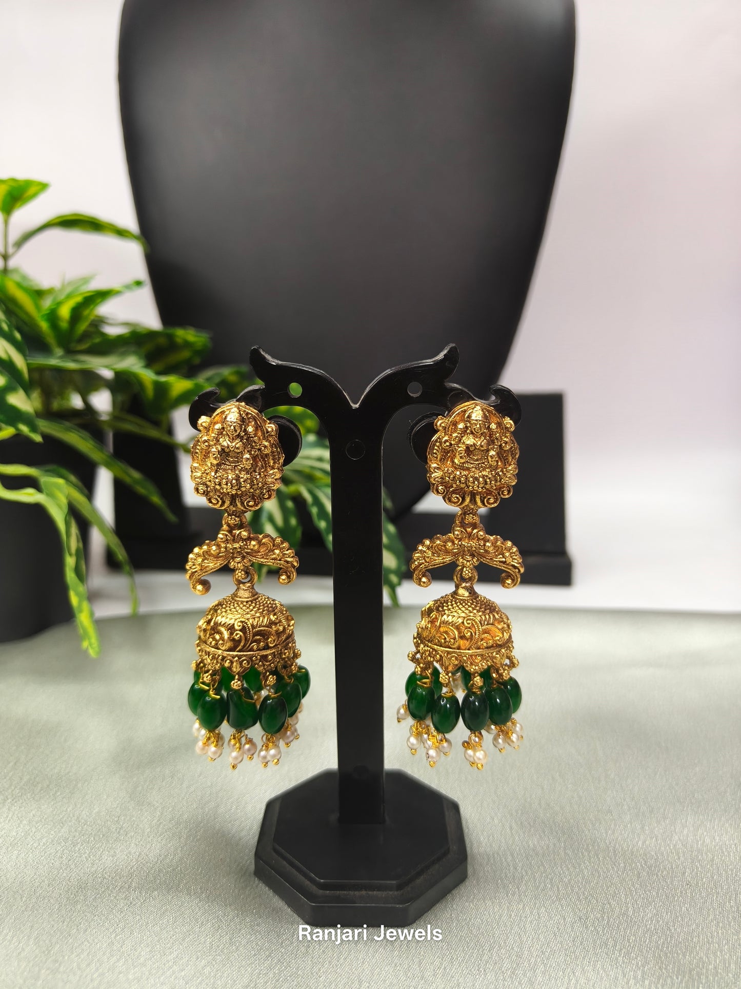 Pranathi – Antique Gold Lakshmi Jhumka Earrings with Green Beads