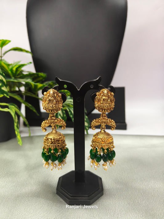 Pranathi – Antique Gold Lakshmi Jhumka Earrings with Green Beads