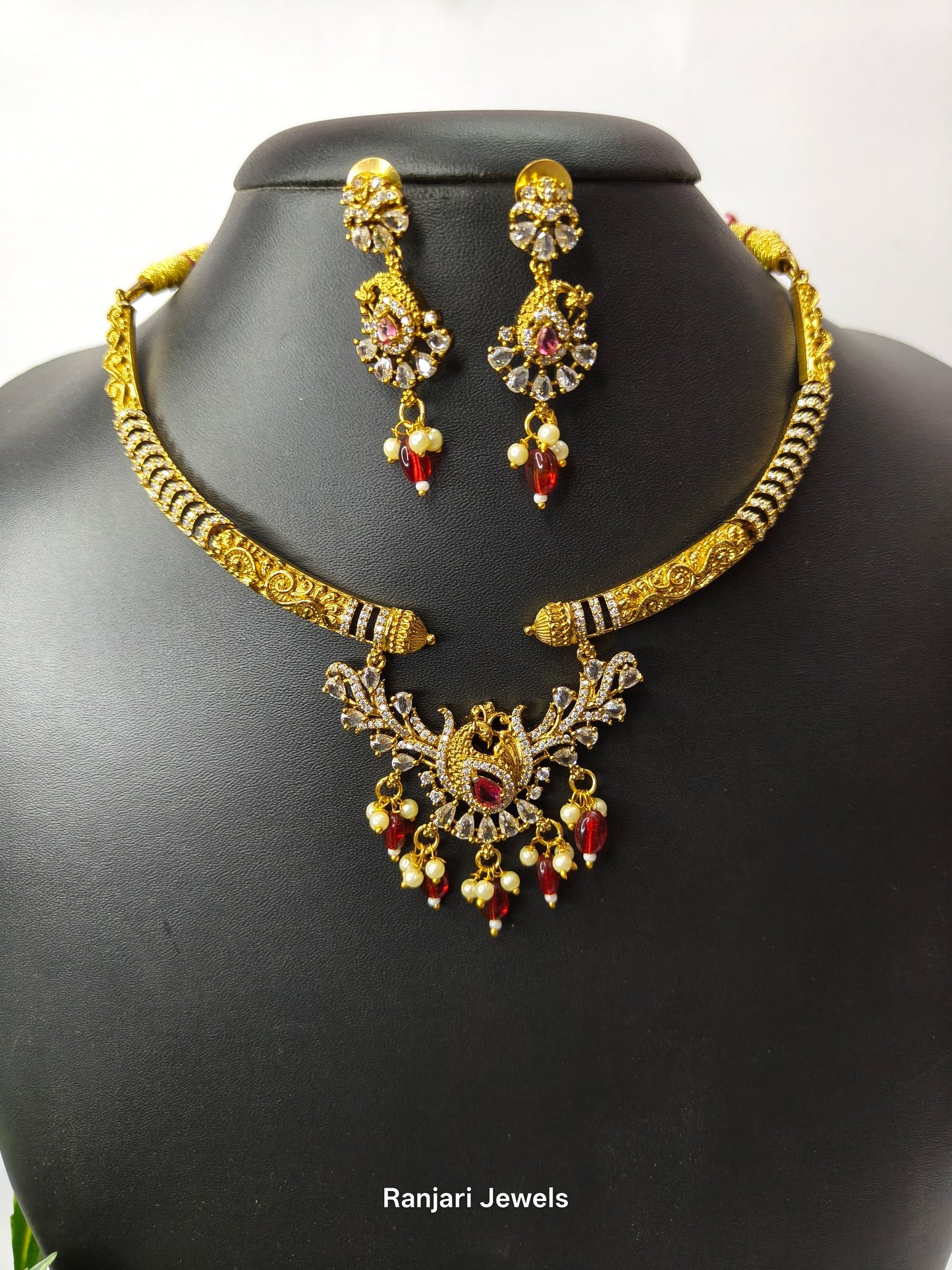 Thaarini – Royal Peacock AD Hasli Necklace Set (Red)